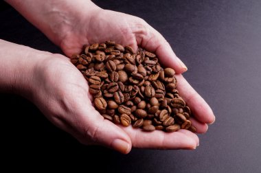 Hands holding Coffee Beans clipart