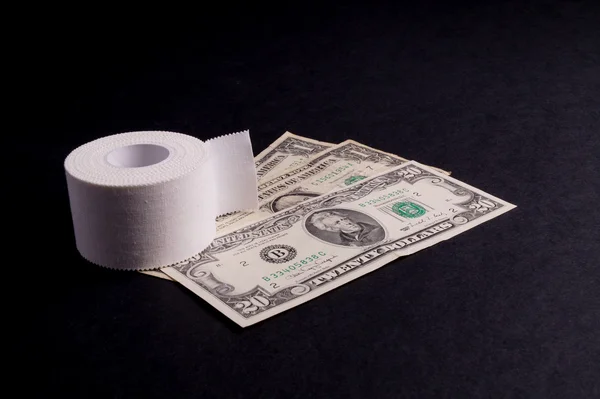Therapeutic self adhesive tape and Money — Stock Photo, Image