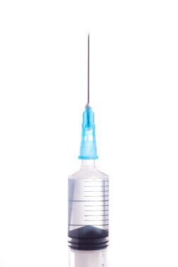 Syringe and needle filled with liquid