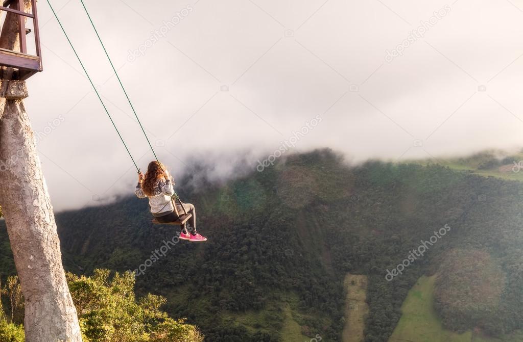 Silhouette Of Young Woman Caucasian On A Swing