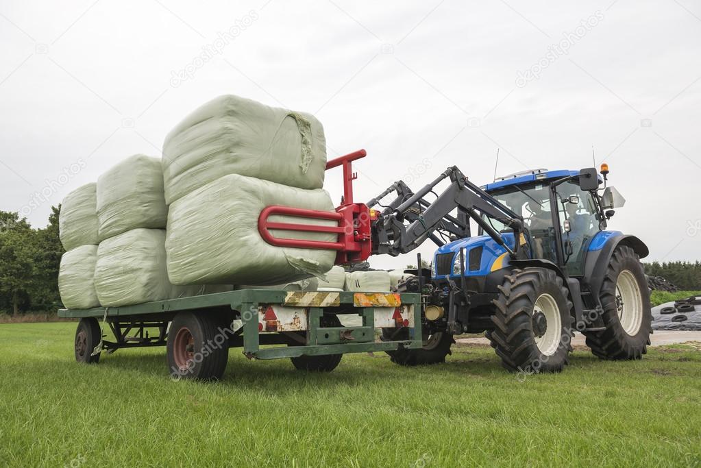 Agriculture loading of plastic hay bale