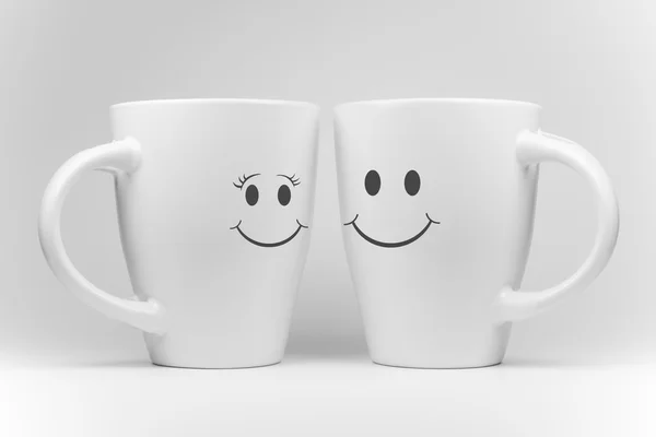 Deux tasses blanches avec expression faciale — Photo