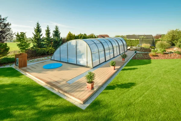 Polycarbonate Swimming Pool Cover in the garden