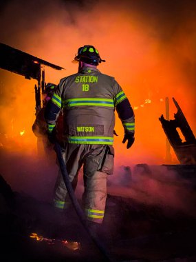 Fire fighter in a active fire