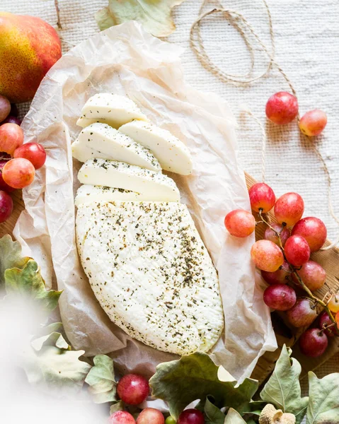 Sliced Halloumi Cheese Parchment Grapes Light Rustic Background Top View — Zdjęcie stockowe
