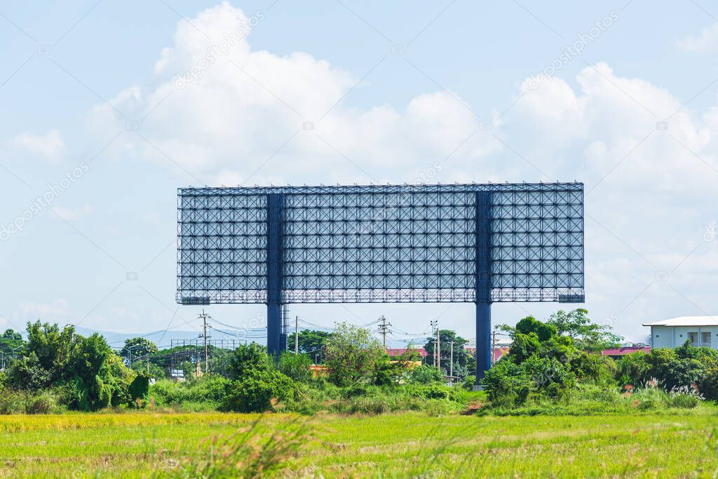 View on empty billboard among a field 