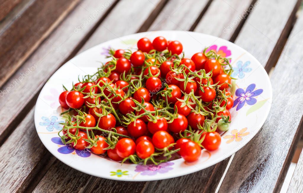 fresh cherry tomatoes on a plate