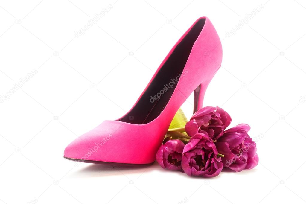 ladies pink high heel shoe and tulips on white, concept female, 