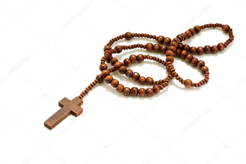 rosary beads with cross made of brown wood isolated on a white background