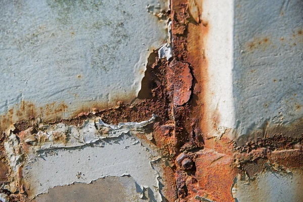 Λεπτομέρεια από ένα ξεπερασμένο τοίχο με ένα σκουριασμένο πλαίσιο ragged σοβά, αφηρημένα φόντο υφή — Φωτογραφία Αρχείου