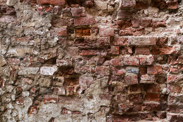 Старая разрушенная кирпичная стена в качестве фона текстуры — стоковое фото