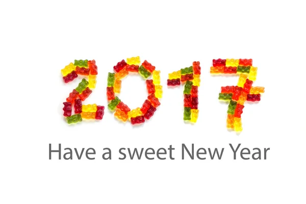 2017 aus Bonbon-Gummibärchen auf weißem Hintergrund, Beispieltext für ein süßes neues Jahr — Stockfoto