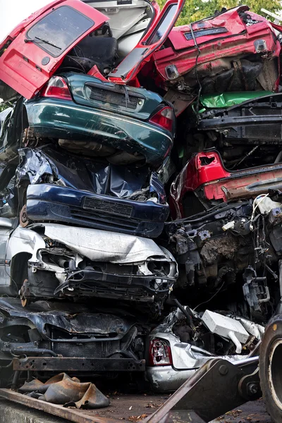 Piled scrap cars on the junkyard, vertical, concept for insuranc or waste management — Stock Photo, Image