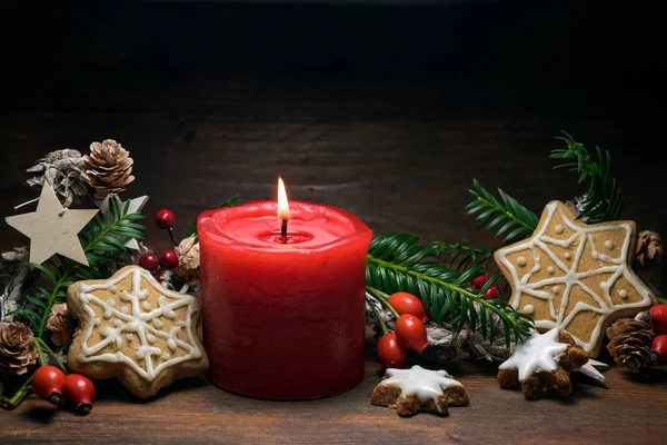 Christmas Decoration Red Burning Candle Gingerbread Cookies Rose Hips Branches — Stock Photo, Image