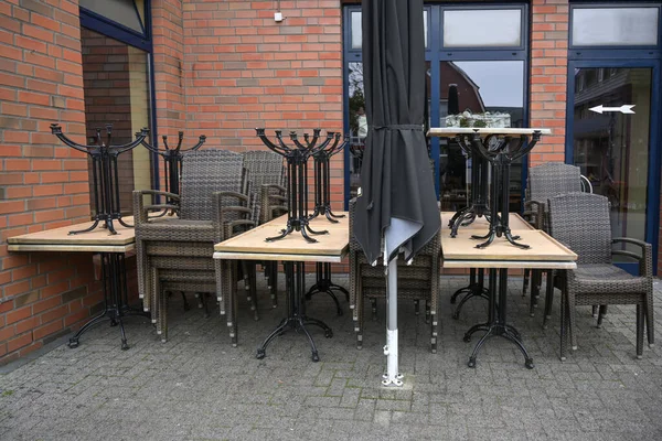 Stacked Tables Chairs Closed Street Restaurant Lockdown Due Coronavirus Pandemic — Stock Photo, Image