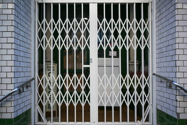 Shuttered Security Grille Front Retail Store Had Close Lockdown Due — Stock Photo, Image