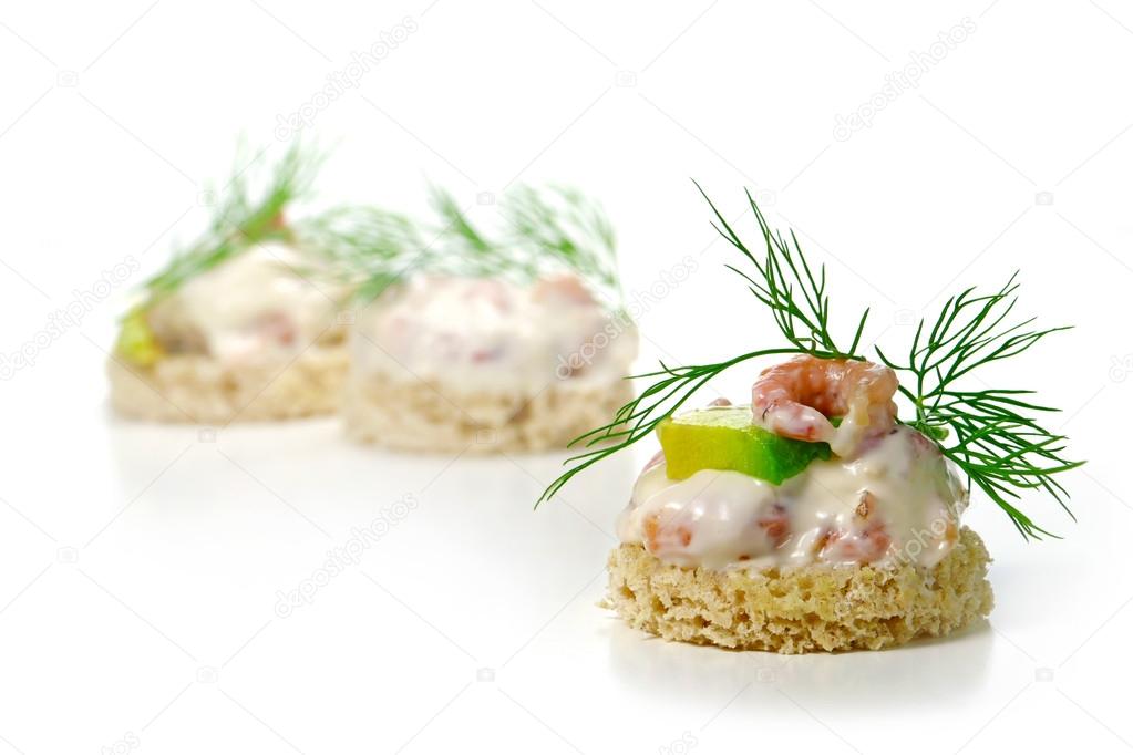 canapes with shrimp cocktail, avocado and  dill garnish, isolate