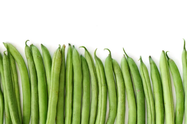 Row of green beans isolated on white — Stock Photo, Image