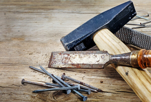 old tools on a background from rustic wood