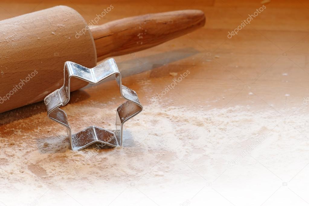 baking background, rolling pin and cookie cutter in star shape o
