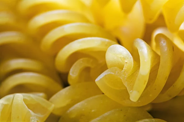 Spiral shaped pasta, close up with selective focus — Stock Photo, Image