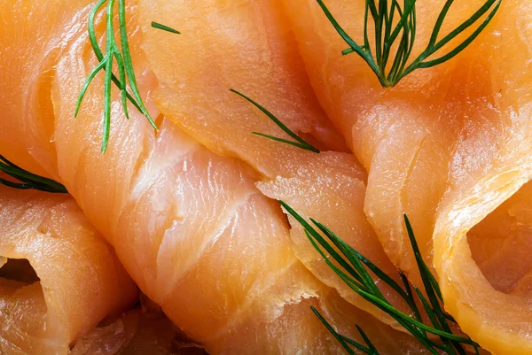 Close up of smoked salmon with dill garnish, food background — Stock Photo, Image