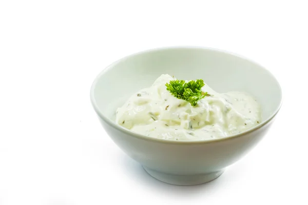Cream cheese dip with herbs in a ceramic bowl isolated on white — Stock Photo, Image
