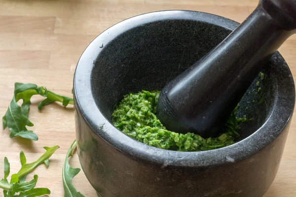 Making pesto with fresh herbs  in a mortar — Stock Photo, Image