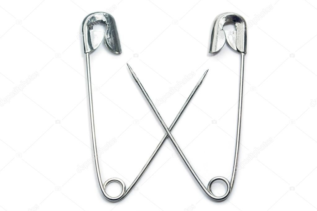 two safety pins cross their arms, isolated on white 