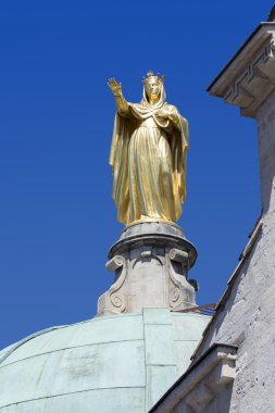 golden statue of Saint Anne on the Cathedral of Apt, France clipart