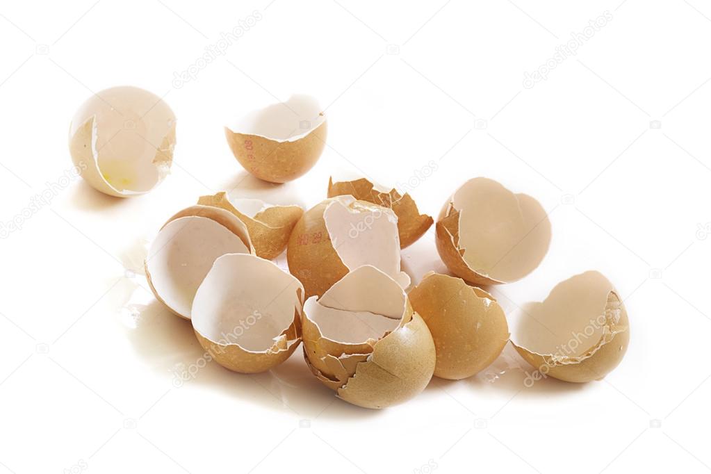 empty broken eggshells isolated on white