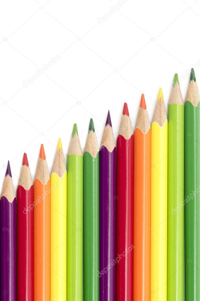 colored pencils  in a diagonal row isolated on a white backgroun