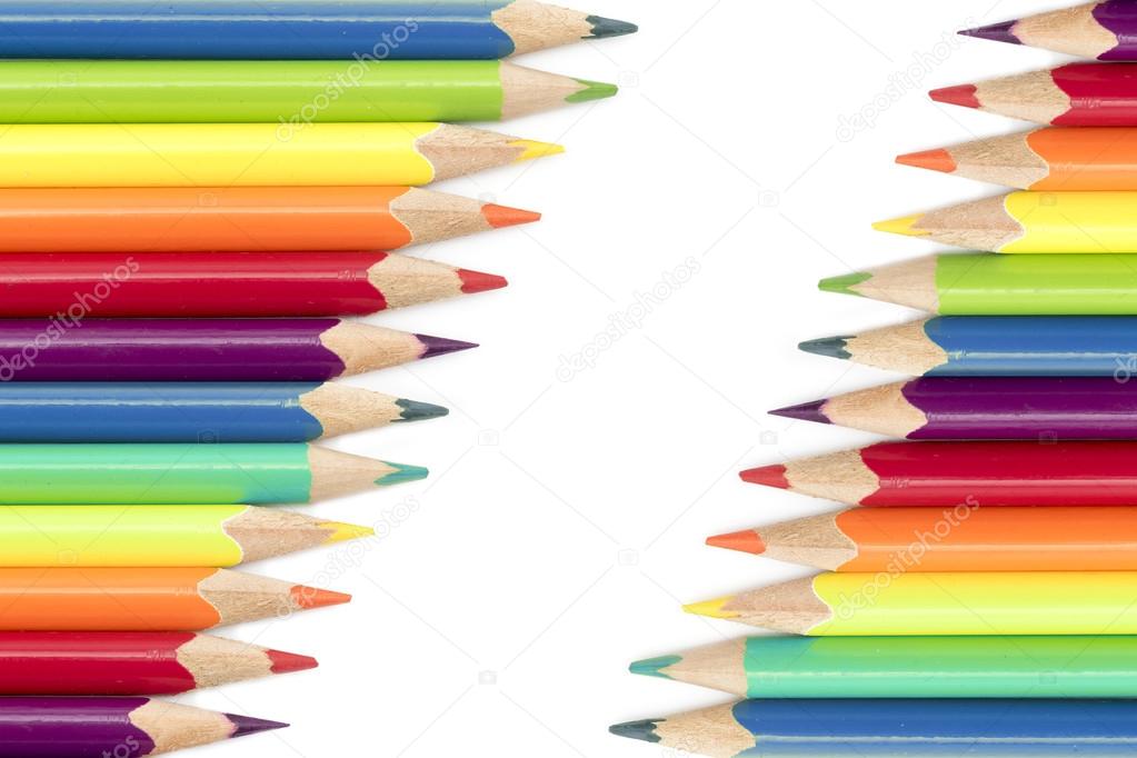 colored pencils  in two diagonal rows isolated on a white backgr