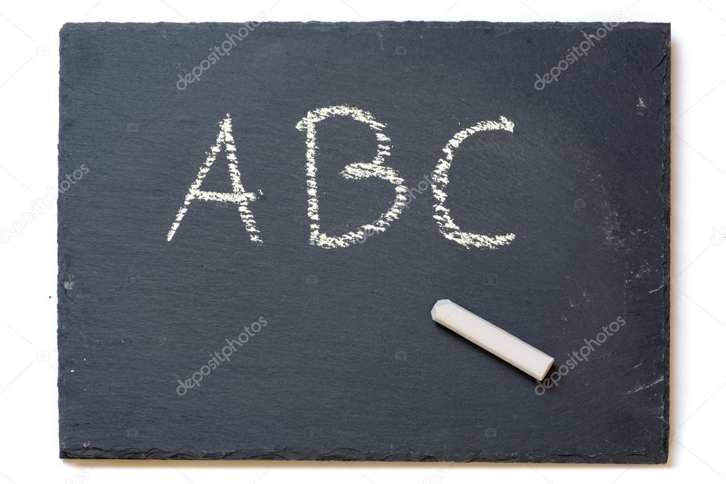 chalkboard with chalk and the letters A, B, C, isolated on white