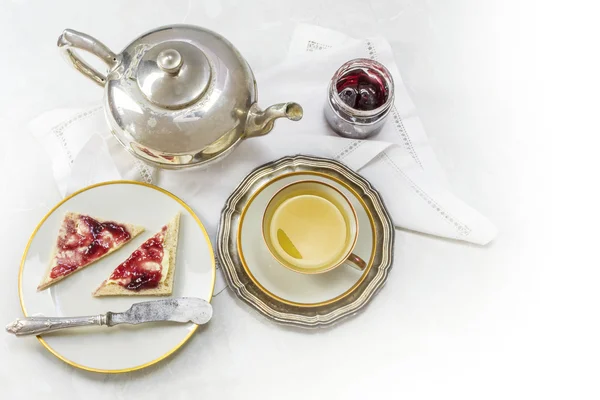 Breakfast with tea, sandwich and jam on white marble as a corner — 图库照片