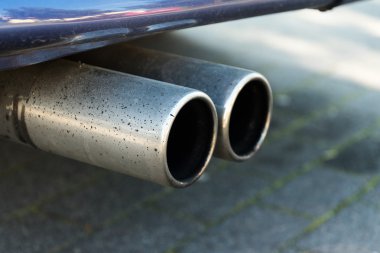 dual exhaust of a car, concept for emissions and particulate mat clipart
