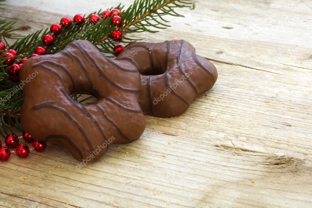 Gingerbread with chocolate and fir branches with  Christmas deco