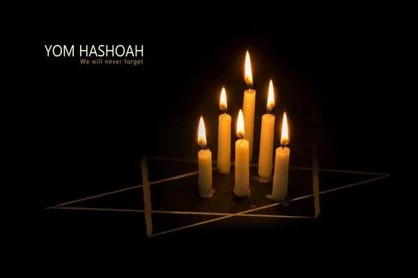 Yom HaShoah, burning candles and the star of David against black — Stock Photo, Image