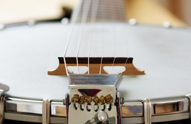 Detail of a metallic banjo 6 strings as music background clipart