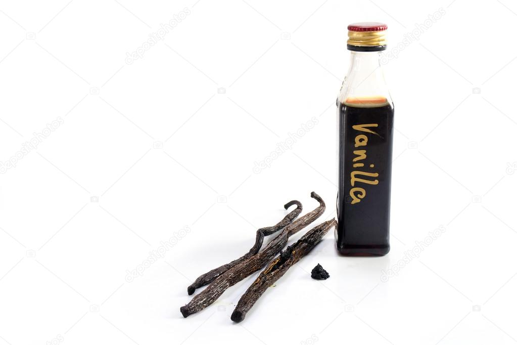 small bottle of homemade vanilla extract and three vanilla beans