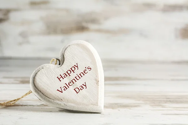 Heart of wood against a white  wooden background, valentines day — Stock Photo, Image