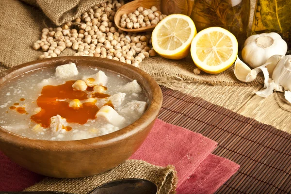 Turkish traditional tripe soup on rustic background with wooden table — Stock Photo, Image