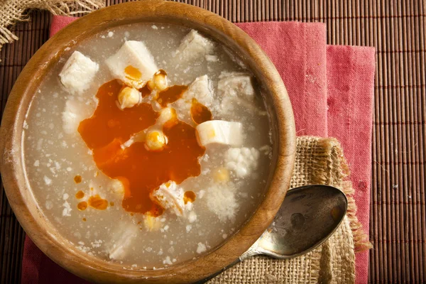 Turkish traditional tripe soup on rustic background with wooden table — Stock Image Turkish traditional tripe soup on rustic background with wooden table Royalty Free Stock Images