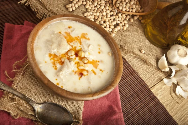 Turkish traditional tripe soup on rustic background with wooden table — Stock Image Turkish traditional tripe soup on rustic background with wooden table Royalty Free Stock Photos
