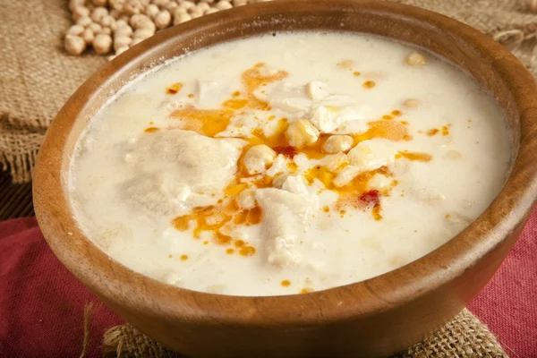 Turkish traditional tripe soup on rustic background with wooden table — Stock Image Turkish traditional tripe soup on rustic background with wooden table Stock Image