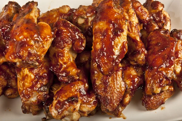 Buffalo BBQ Chicken Wings on wooden table
