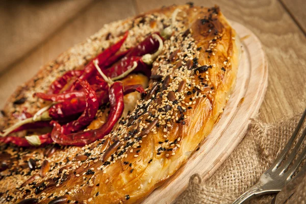 Turkish style meat and cheese stuffed filo dough borek served kol boregi with chilli pepper — Stock Photo, Image