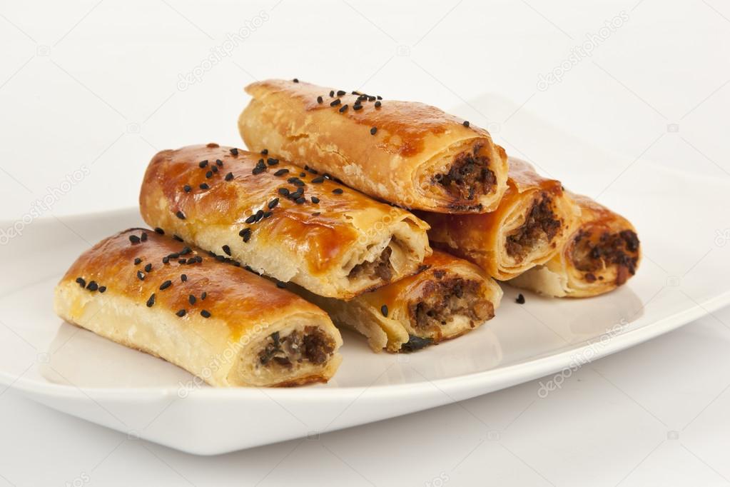 Turkish style meat stuffed filo dough rolls served