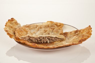 Turkish meat pie fried in oil ( Cig borek ) ( Raw pie or Tatar pie ) clipart