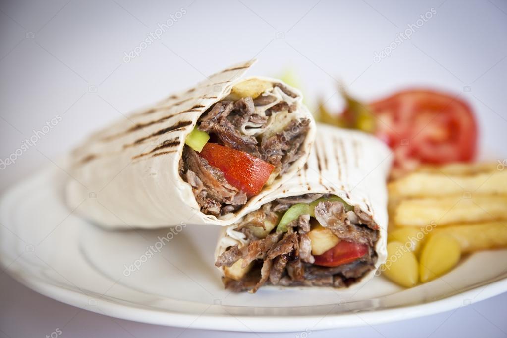 Doner Kebab - grilled meat, bread and vegetables shawarma sandwich